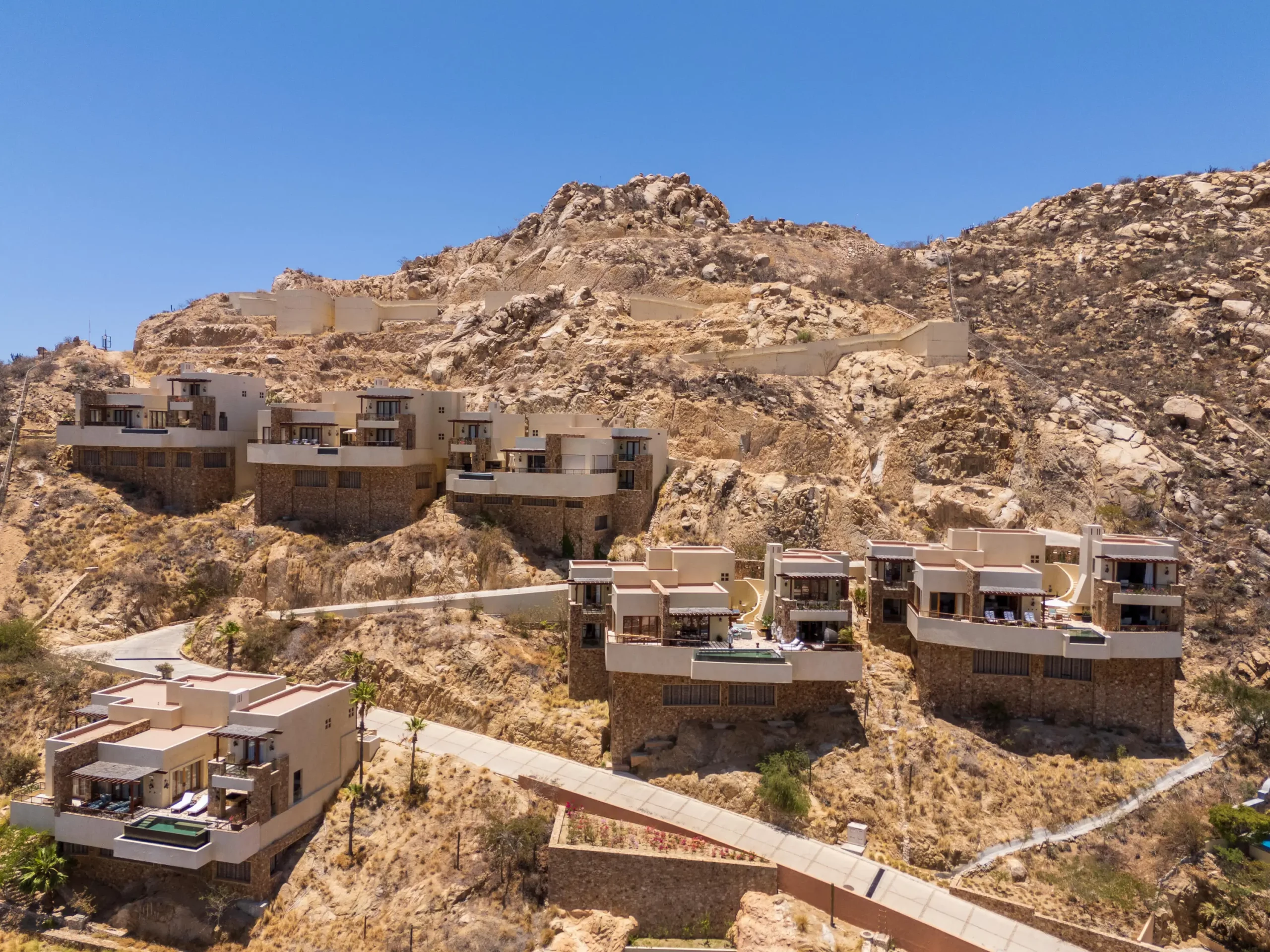 Cliffside Pedregal Luxury Homes for Sale with infinity-edge pool overlooking Pacific sunset in Cabo