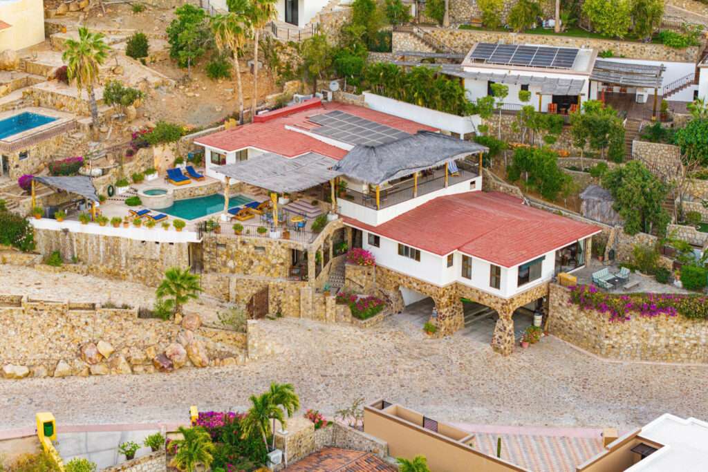 Pedregal Pedregal Csl Villa Felicidad is a 5-bedroom, 5.5-bath residence in Pedregal that combines scale, location, and proven income potential. Set just minutes from the main gate and within walking distance to the marina, it offers effortless access to Cabo's best dining and nightlife while maintaining privacy. The home features a private pool, expansive terraces, and panoramic marina – 25 Camino Grande Pedregal, Cabo San Lucas, BS