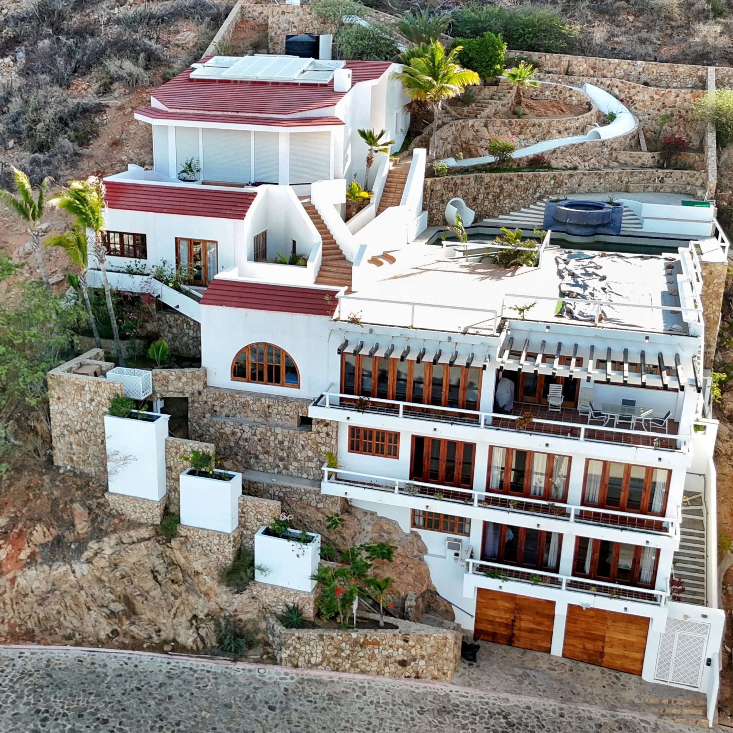 Pedregal Pedregal Csl Perched high above the marina and the Sea of Cortez, this extraordinary 10,000-square-foot estate is one of Pedregal's most iconic residences. Carved into the granite hillside, the property represents a remarkable piece of Cabo San Lucas history and offers an architectural experience unlike any other in Los Cabos.Panoramic – 115 Cam. Grande, Cabo San Lucas, BS