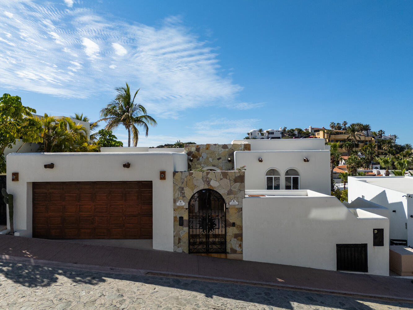 Pedregal Blue Moon La Casa Bendecida, (The Blessed House), blends luxury, comfort, and convenience. This lovingly designed villa evokes a peaceful, refined ambiance, filled with the color and vibrancy of Mexico. Situated in the private community of El Pedregal, known as the ''The Beverly Hills of Cabo San Lucas,'' this gated community offers 24 hour security, cobblestone streets, lush landscaping, a beautiful private beach, and access to the exclusive owners only Mountain Club with a restaurant, gym, tennis courts, and pickleball courts.La Casa Bendecida is inspired by Mexico's rich traditions and craftsmanship, including Talavera tile, Palo de Arco wood, brick ceiling arches, and colorful folk art. A magnificent art collection enhances the villa's spaces. The layout maximizes indoor-outdoor living with numerous lovely areas to gather, including scenic outdoor terraces and portals. Windows frame postcard-worthy glimpses of the Sea of Cortez and the Pacific Ocean, with gorgeous sunrises and sunsets. The flowing open concept of this villa connects the spacious main living room, the well-equipped kitchen, and the dining room. Each of the four bedrooms offer unique themed design, decor and vibrant artistic touches paying homage to Mexican art, folklore, and local natural landscapes. There are 3 full bathrooms and a gorgeous talavera tiled outdoor shower. Outdoor living features a hot tub, swiimming pool, a Bar-height Fire Pit Dining Table, tables and chairs for relaxation around the pool, a dining table that seats 8 and several lovely portals with talavera tiled steps. There is even a swing for two to enjoy the breathtaking sunsets over the Pacific.La Casa Bendecida was transformed and remodeled and redesigned in 2021 by the current owners, who chose to return it to a home that reflected all that they love about Mexico. It is offered completely turnkey for a buyer seeking a fully furnished, income producing property. Everything needed to continue on with this proven rental performance home is provided for you. Overlooking the gorgeous park setting of the Valley of the Blue Moon, La Casa Bendecida is a seven minute walk to the beach. The recently updated Blue Moon Park common area offers exercise equipment and walking paths.Additional features include fiber optic WiFi, HD Smart TVs, mini split air conditioning, ceiling fans in every room, an Alexa sound system, a whole house water purification system, 2 sets of washer dryers, and a large full garage with lots of storage areas.La Casa Bendecida welcomes you with open arms as you make cherished memories here that will last a lifetime.Notes:This home has been completely renovated twice in the past 10 – La Casa Bendecida, Cabo San Lucas, BS